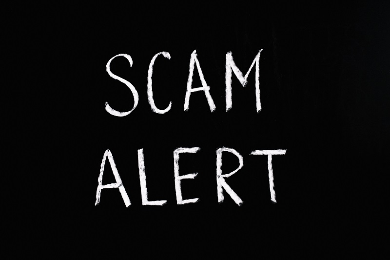 Black Background with Scam Alert written in white informalfont