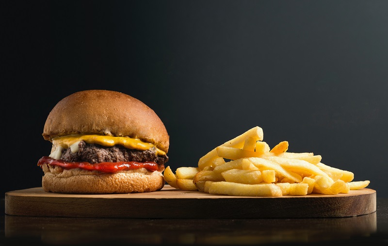 3 Exploits Of The Anchoring Effect - An image showing a burger with French fries beside it.