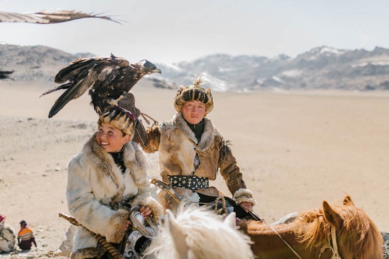 Red-Indian hunters on horses.