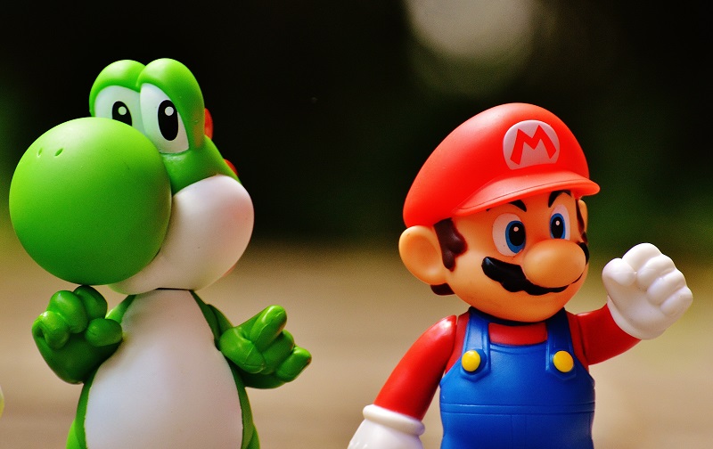 Living In A Simulation - An image showing a Mario toy and a Yoshi toy side by side.