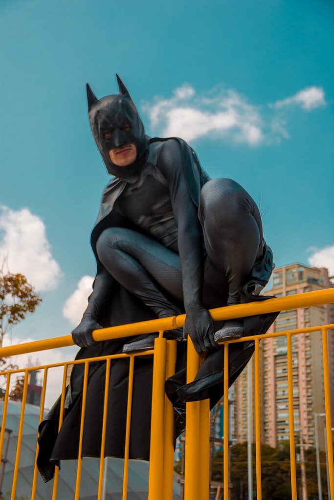 Can We Stop Lying All The Time? - An image showing a funny looking person badly dressed as Batman and perched up on a rail.