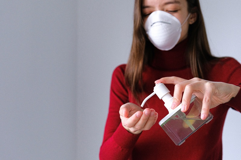 A woman using a disinfectant - to illustrate why a soap-resistant epidemic doesn't exist