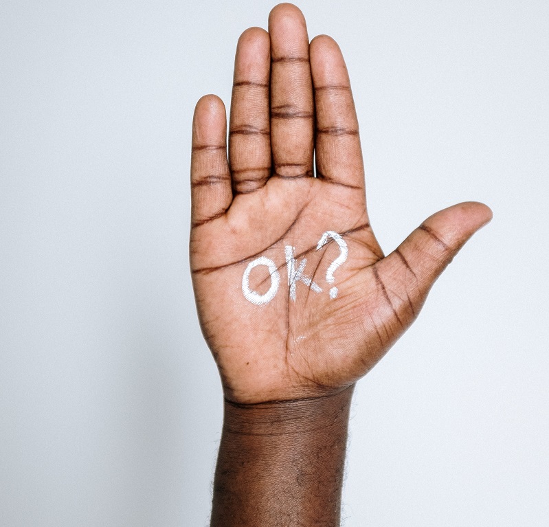 A hand with 'ok?' written on it - Is there any such thing as a stupid question