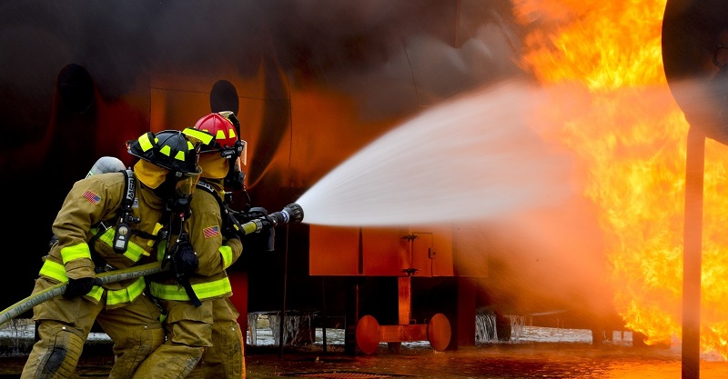 Firemen putting out fire with water - to illustrate why water is remarkably effective at putting out fire