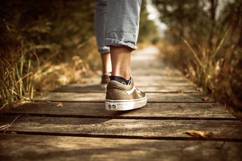 A picture of the feet of a person taking a relaxing walk - to illustrate how to learn faster and more efficiently