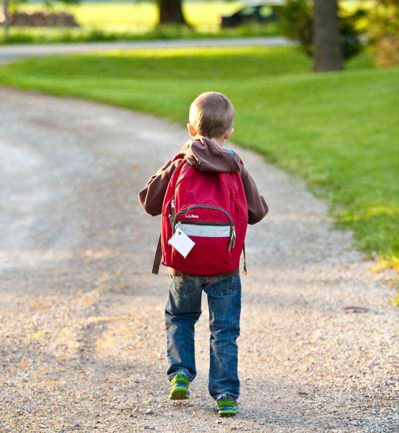 A child walking timidly down a walkway - Is it time for us to reimagine regular education?